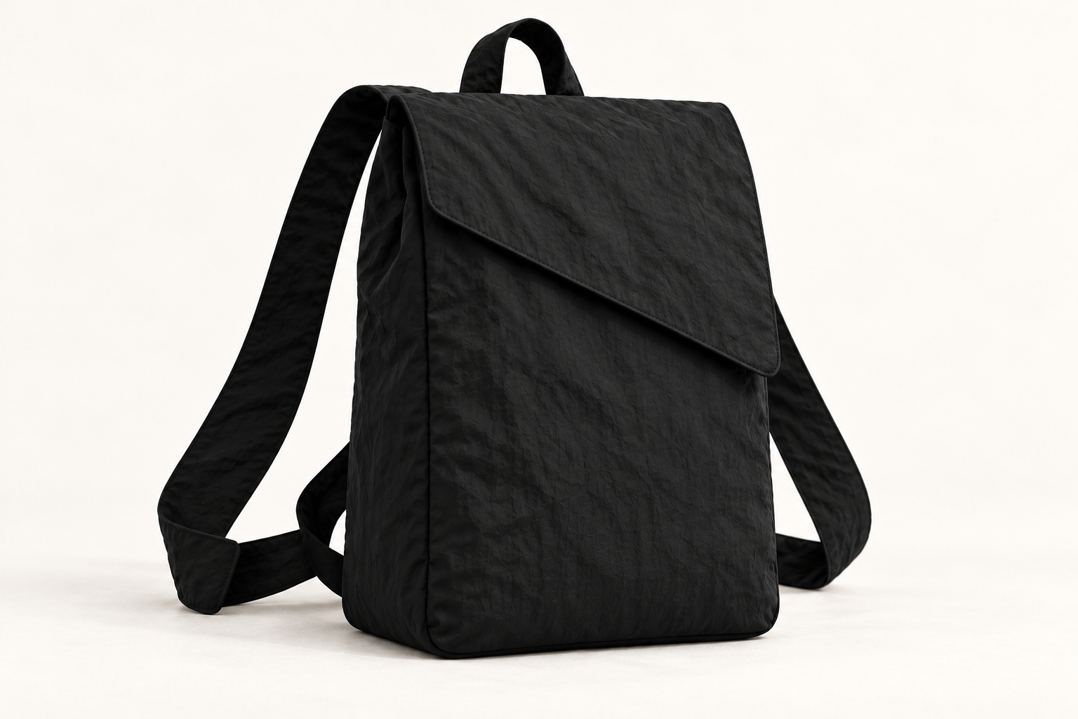 Taller Monofloat backpack concept in black, with a diagonal flap and a concealed catch study.