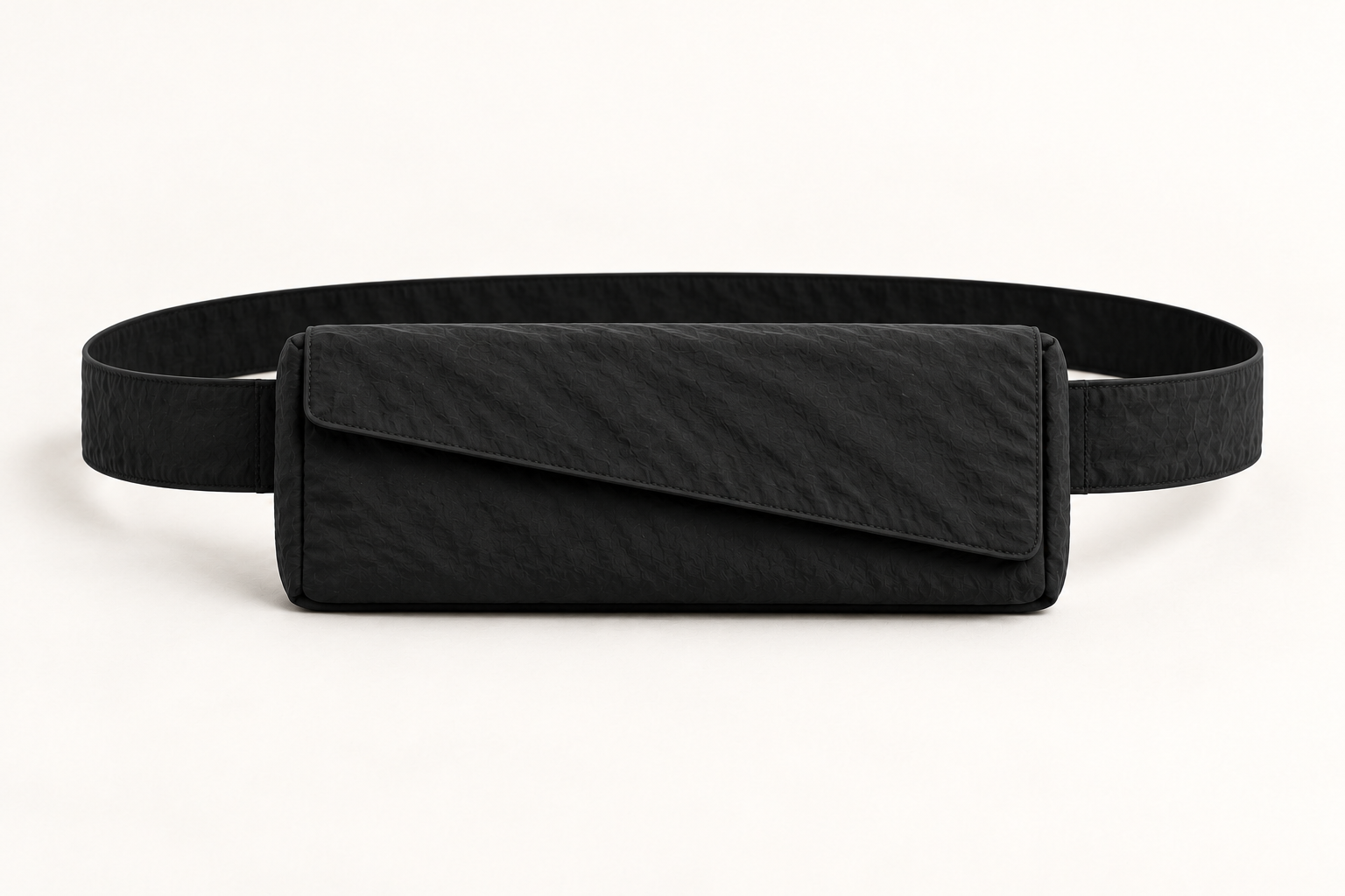 Monofloat film bag concept in black, with a level rectangular body, diagonal flap and a strap for waist or crossbody wear, proportioned around six upright film canisters.