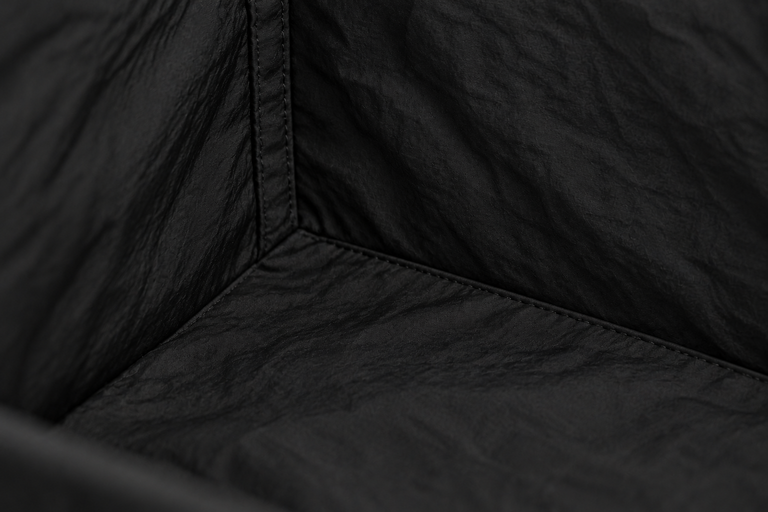 Detail study of the soft nylon lining inside the Monofloat crossbody.